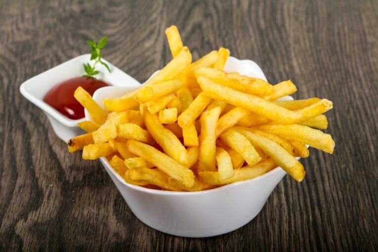 vecteezy_french-fries-in-a-bowl-on-wooden-background_12841970-scaled-1.jpg